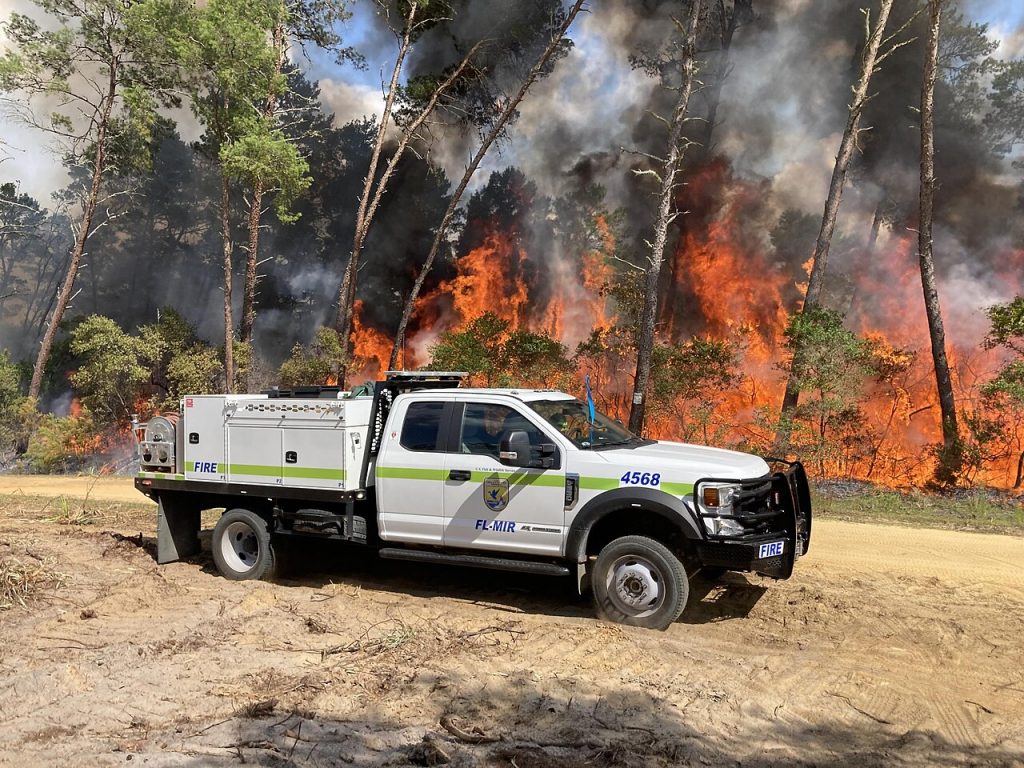 Brush truck working a wildfire in Florida scrubland